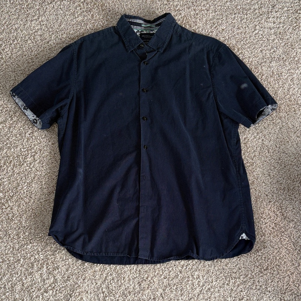 Navy blue and polka dot button up short sleeve polo